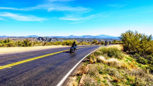Motor bikes navigating the curves of the Bartlett Dam Road in Tonto National Forest near Phoenix in Maricopa County in the USA
