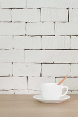 White color brick background and texture, with wooden table as a foreground