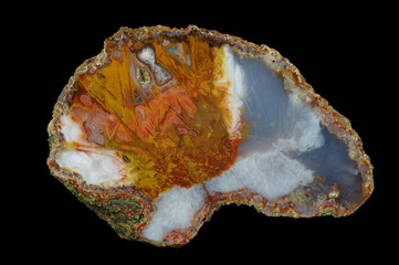 A cross section of the agate stone. Multicolored silica bands colored with metal oxides are...