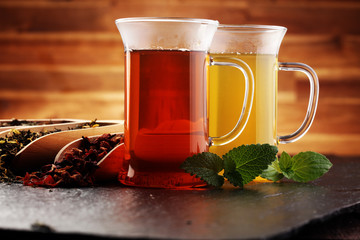 Tea. Herbal tea. Mint leaf. Tea in a glass cup, mint leaves, dried, sliced lime. herbs on a slate plate in a restaurant or teahouse