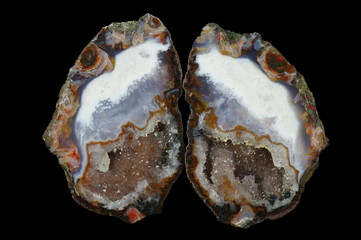 A cross section of the agate stone with quartz geode.  Multicolored silica rings colored with metal...