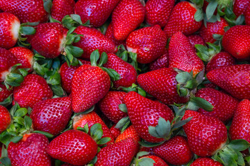 a scattering of ripe fresh juicy delicious strawberries