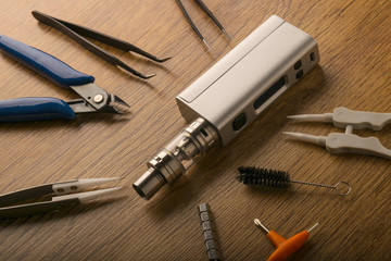 vape device or electronic cigarette with vaping tools and accessories.