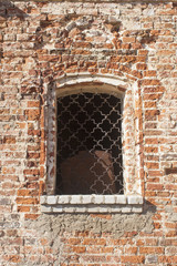 Fototapeta na wymiar Barred window in a brick wall