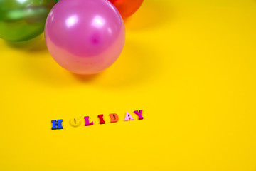 Abstract yellow background with holiday sign and balloons