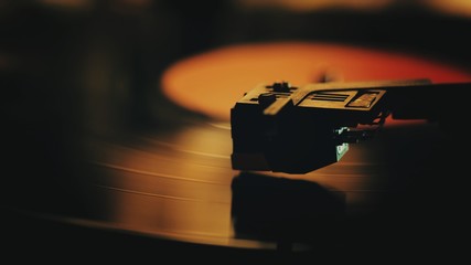 A retro-styled spinning record vinyl player.. Close up.