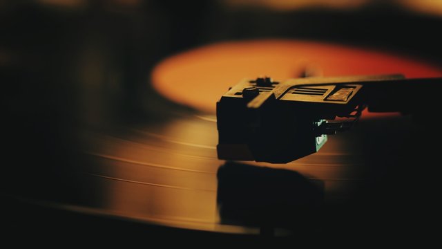 Fototapeta A retro-styled spinning record vinyl player.. Close up.