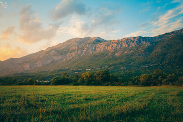 Mountain landscape in Croatia at sunset. Fields and mountains in Croatia
