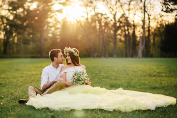 A loving couple hugging in a spring park