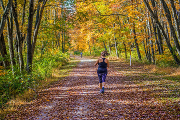 Fototapeta premium Running Through Fall Park
