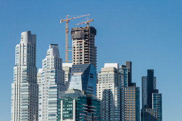 Obraz premium Tower of apartments under construction in the neighborhood of Puerto Madero, Buenos Aires, Argentina