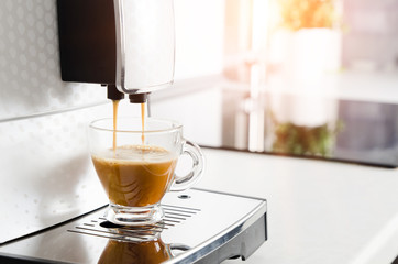 Professional home coffee maker machine making espresso