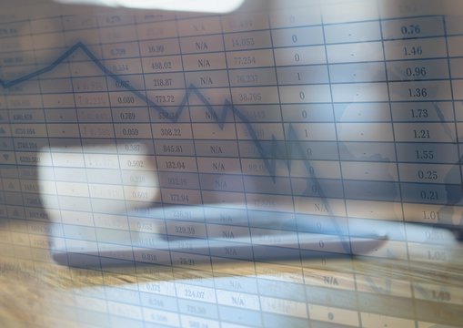 Tablet in cafe and blue graph overlay