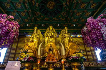 Lion statue and buddha state on chinese temple in Thailand