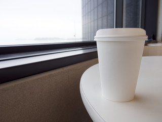 White Disposable Coffee Cup on Table