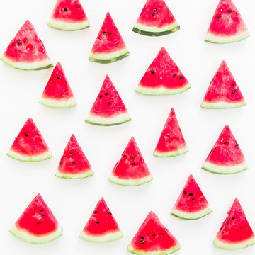 Tasty slices of juicy watermelon on white background. Flat lay. Top view. Summer pattern