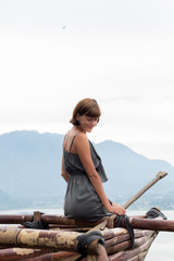 Young attractive woman in the mountains of tropical island Bali, Indonesia.