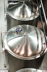 Metal tanks for beer storage. Clean and glossy surface of stainless steel.