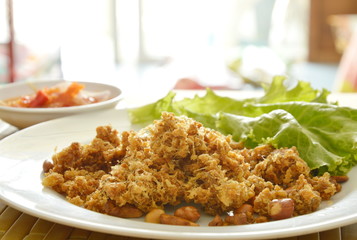 crispy fried minced catfish with green mango salad and sauce