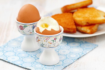 Boiled eggs and toasts for breakfast