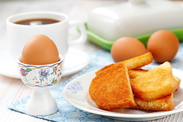 Boiled eggs and toasts for breakfast