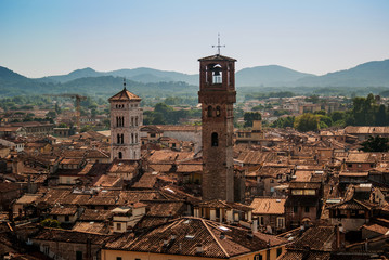 Roofs and Torre delle Ore, Lucca, Italy - obrazy, fototapety, plakaty