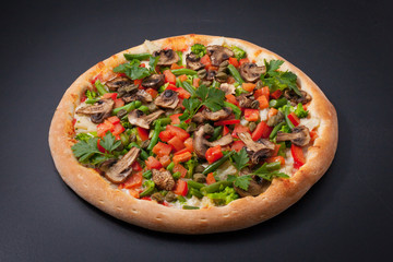 Vegetarian pizza with mushrooms, beans, tomatoes, greens, on a chalkboard