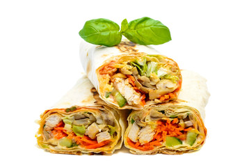 Traditional Middle Eastern food - shawarma. Lavash stuffed with chicken, vegetables, mushrooms and sauce. Isolated on white background.