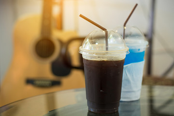 soft tone of iced americano and Blue Hawaii with sunshine and guitar background.