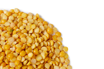 Dry yellow split peas isolated on white.