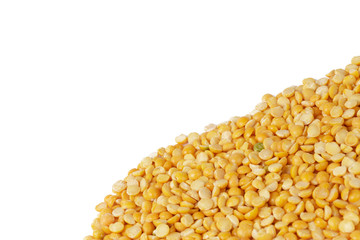 Dry yellow split peas isolated on white.