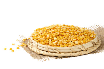 Dry yellow split peas isolated on white.