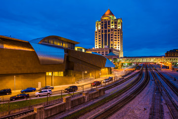 Railroad tracks and buildings in downtown at night, in Roanoke, Virginia.