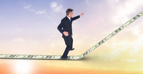 Fototapeta premium Digital composite image of businessman standing on money walkway