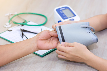 Doctor Checking blood pressure - close up..