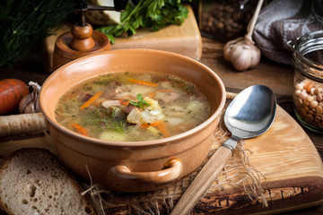 Pea soup with vegetables and bacon.