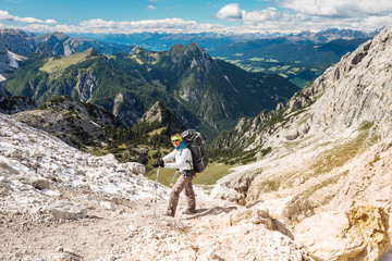 Fototapeta na wymiar Hiker enjoying view from top of mountain