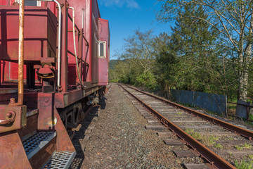 Fototapeta premium Old caboose on train tracks