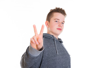 teenager showing victory sign