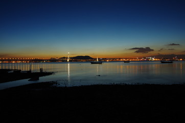 colorful dusk after sunset at Lau Fau Shan, Hong Kong. The bridge at the background links Hong Kong and China.