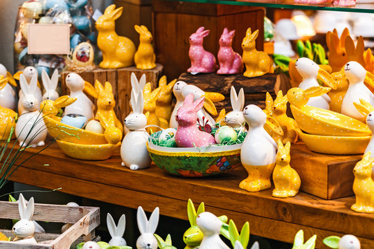Ceramic toy Easter rabbits on sale at the window of a souvenir shop