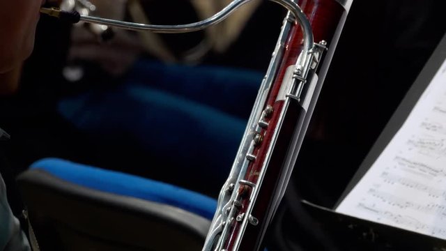Musician playing the fagotto, closeup