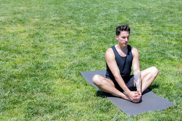 Man doing Yoga in Yerba Buena Park