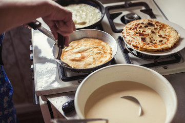 Grandmother making pancakes