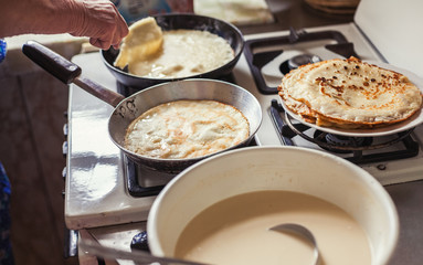 Grandmother making pancakes