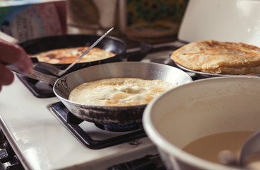 Grandmother making pancakes