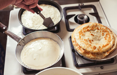 Grandmother making pancakes