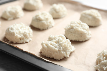 Baking tray with delicious coconut macaroons, closeup
