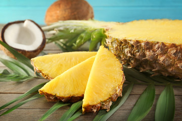 Pineapple and coconut on wooden table