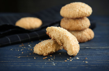 Delicious coconut cookies on wooden table